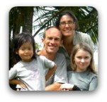 family of four with palm tree