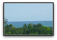 Property Has Wonderful Ocean Views View of Green tree tops, blue ocean and blue sky